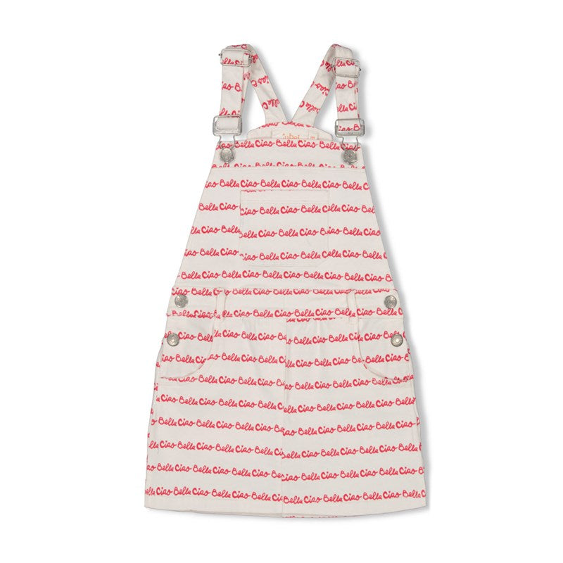 Flottes Salopette-Kleid in weiß mit rotem All Over Druck Ciao Bella. Die verstellbaren Träger sind individuell anpassbar.