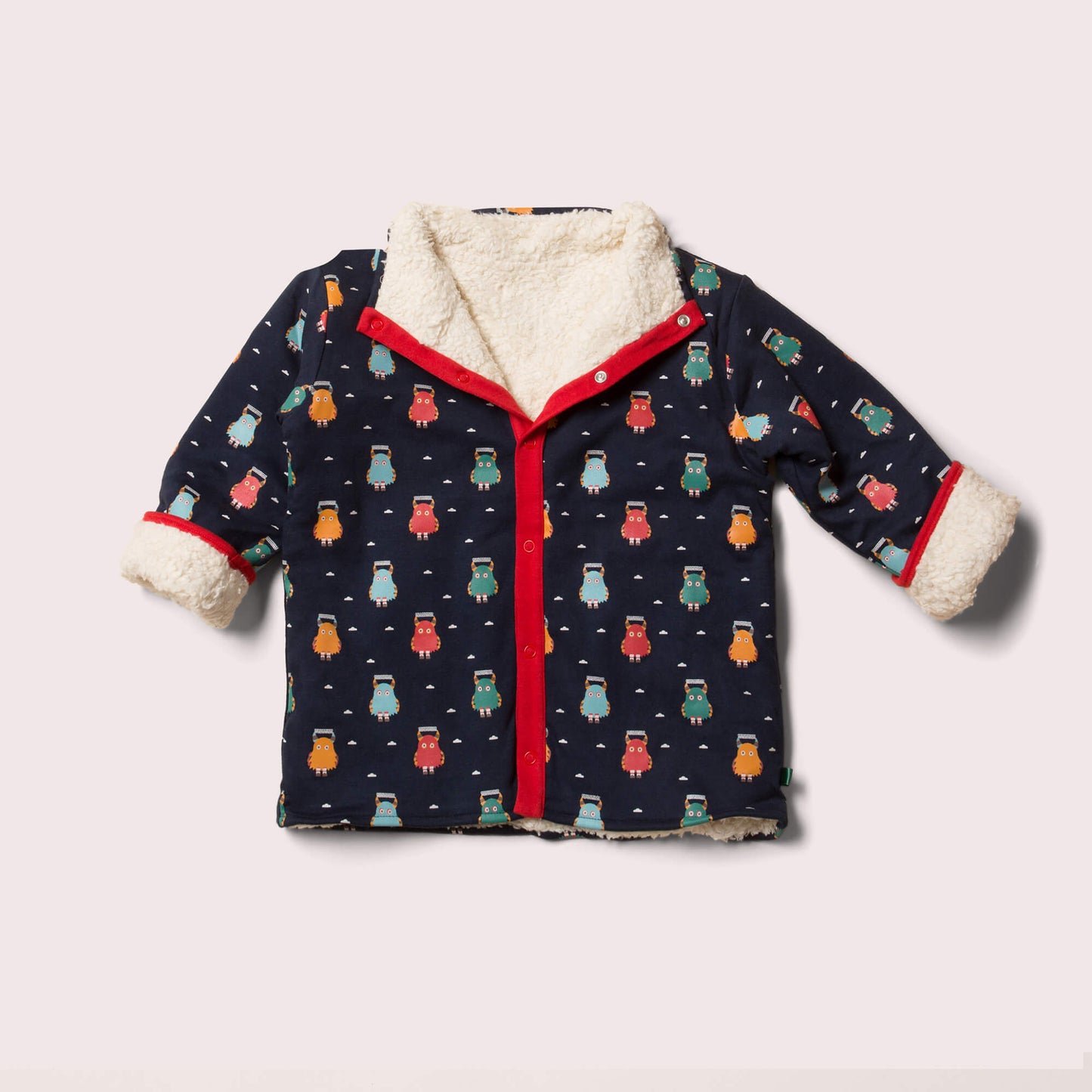 Niedliche Wendejacke in blau mit kleinen frechen Monstern darauf, aus 100% Bio und Fairtrade Baumwolle