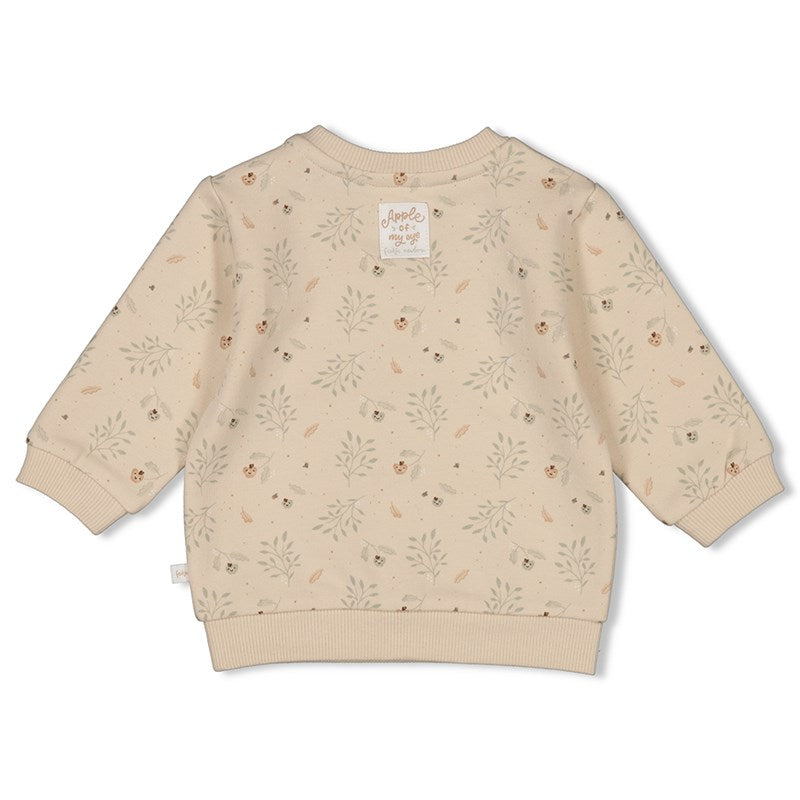 Süßer Sweater aus Bio-Baumwolle n Sand mit Blättern darauf