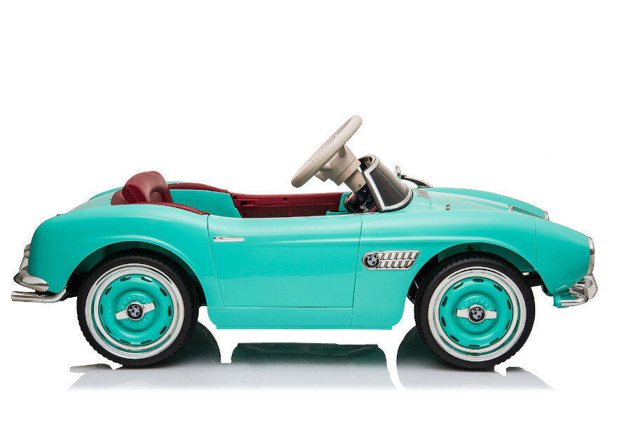 Wunderschöner BMW Oldtimer in grün mit dem dein Kind stilvoll durch die Stadt fahren kann 