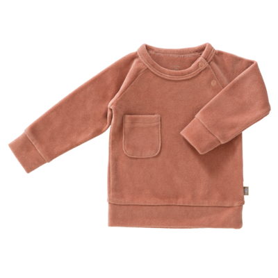Schöner Baby-Pulli aus weichem Velour in rosa. Hergestellt aus Bio-Baumwolle.